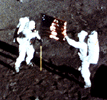 scene from Apollo 11 landing, with U.S. flag 